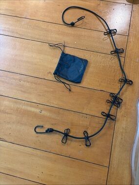 Traveling Clothesline by Samsonite. 42” un stretched. Can stretch to 60”.